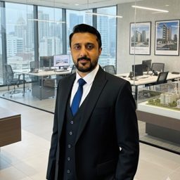 Munir Sells Ajman logo