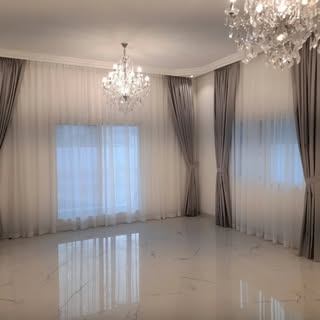 Curtain and Carpet logo